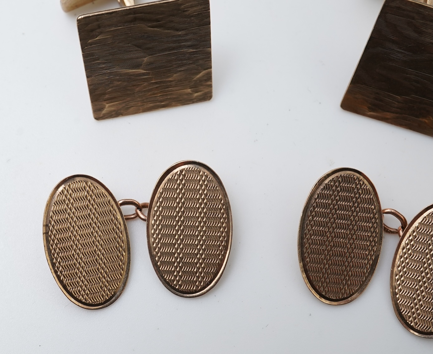 Two pairs of gold cufflinks